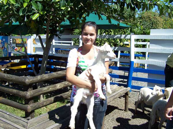 image of Mariela holding goat